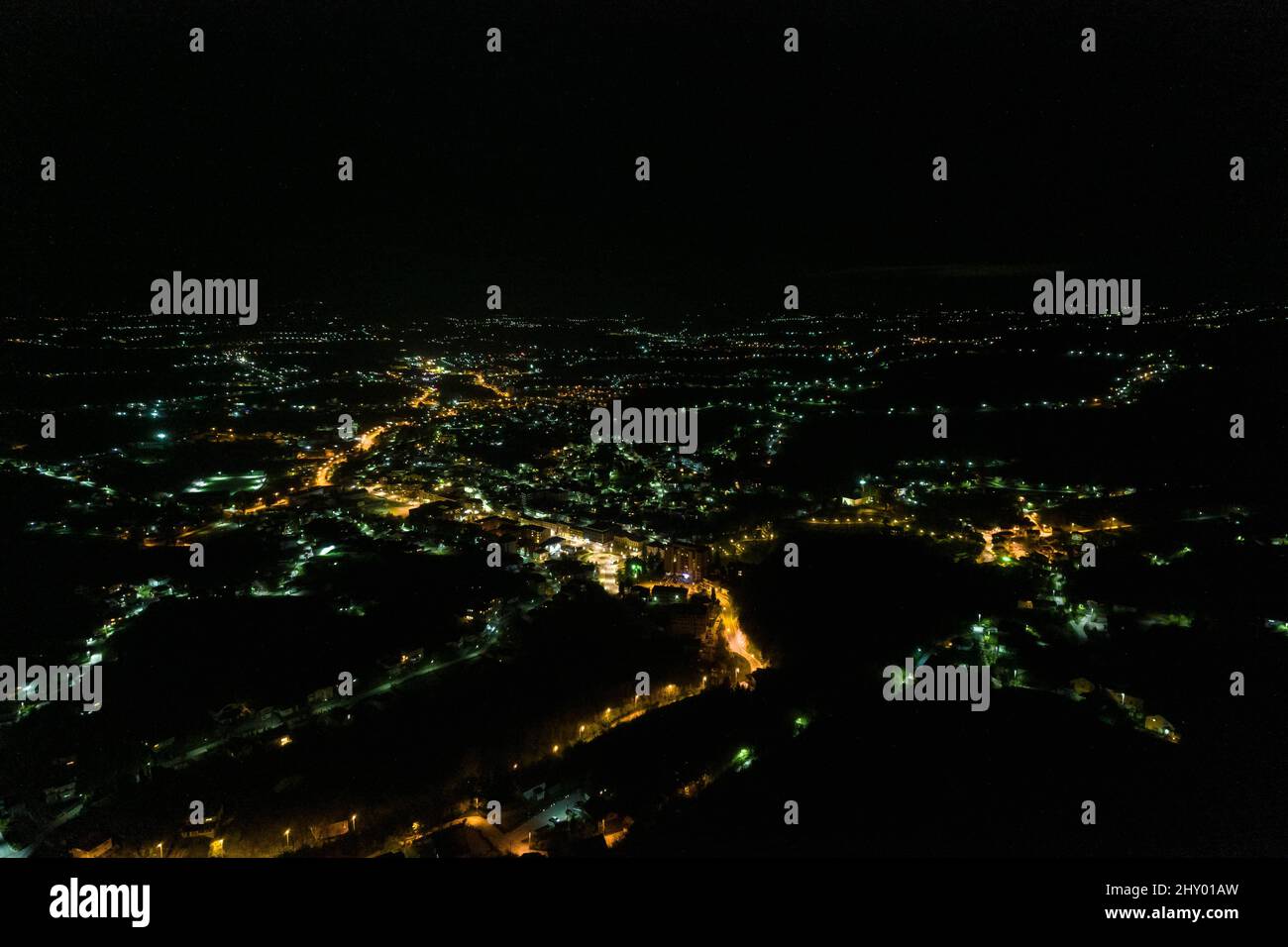 Aerial view of a modern city with the street and building lights ...