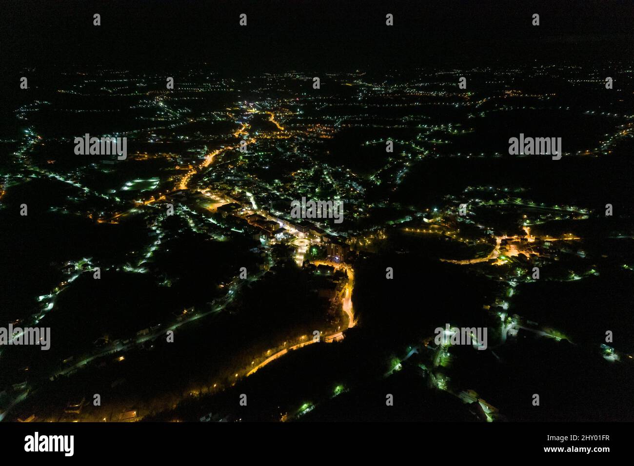 Aerial view of a modern city with the street and building lights ...