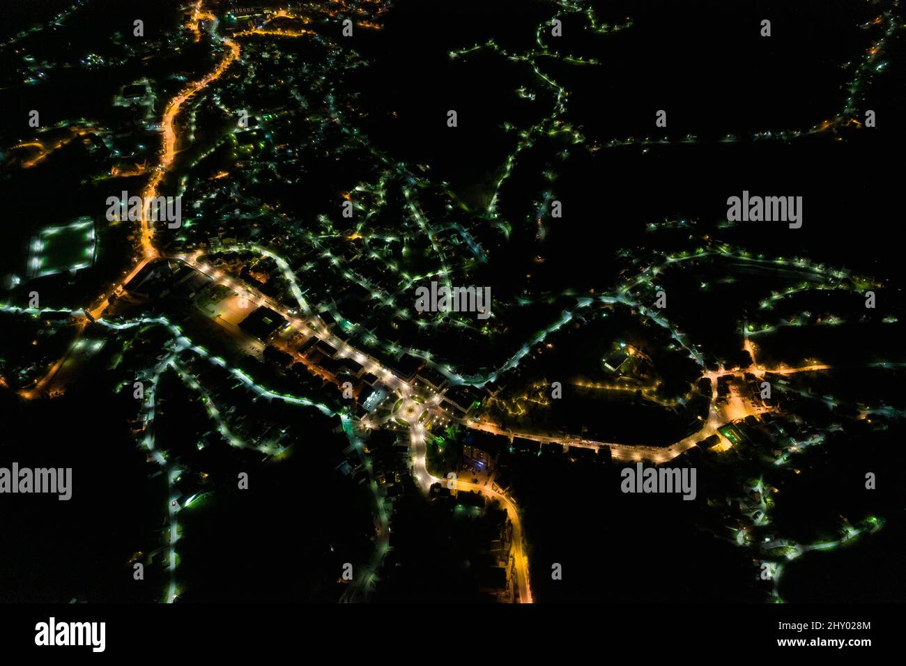 Aerial view of a modern city with the street and building lights ...