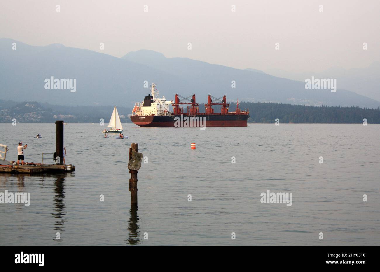 Big cargo and sailing ship in English Bay, Vancouver, Canada Stock