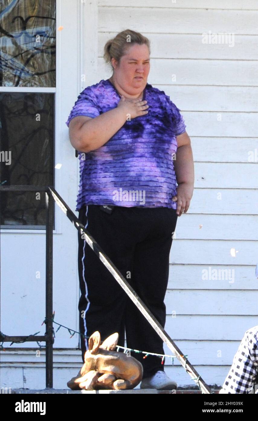 June Thompson, mother of Honey Boo Boo, standing on her porch in