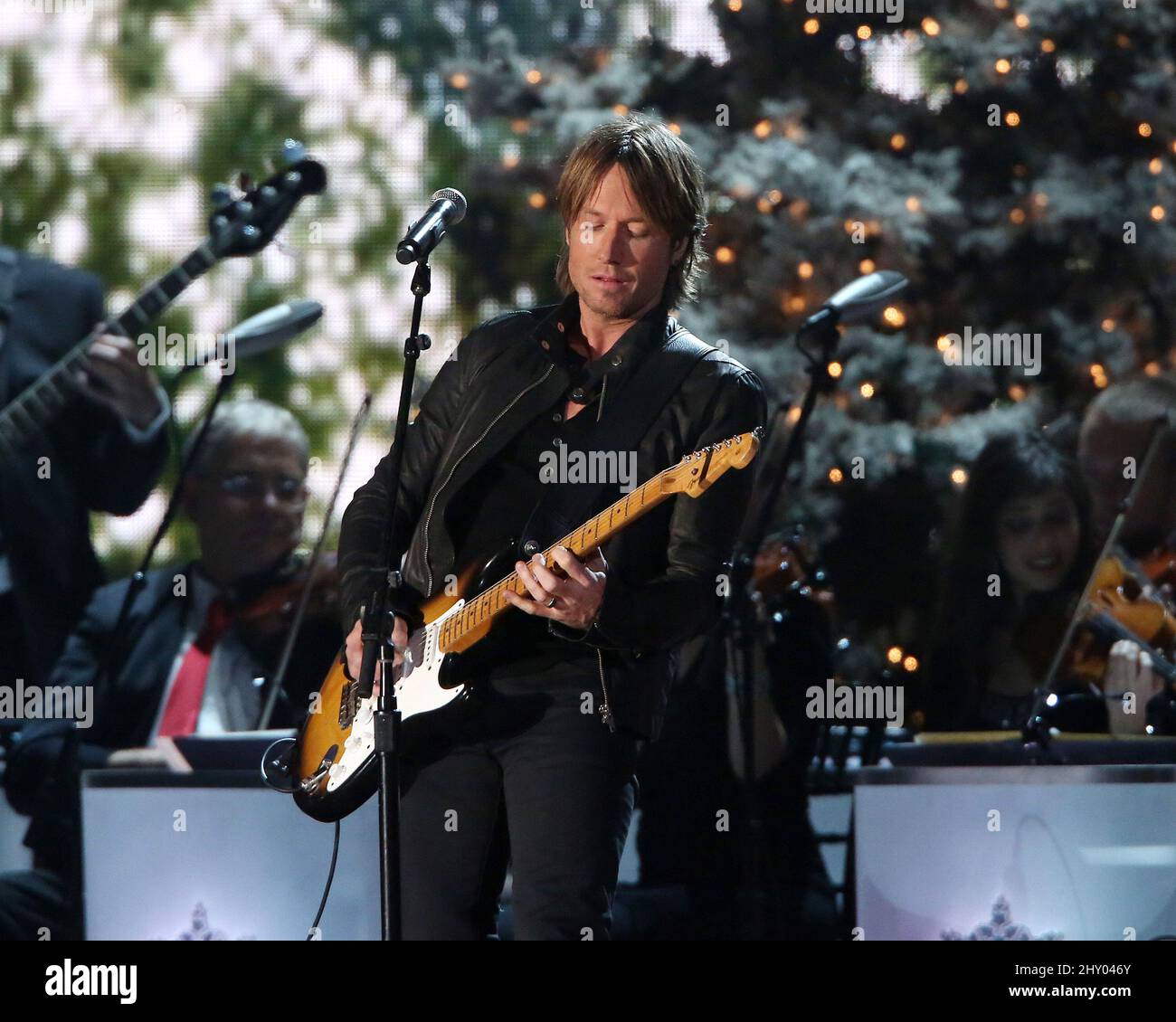 Keith Urban performing live on stage during the CMA Country Christmas