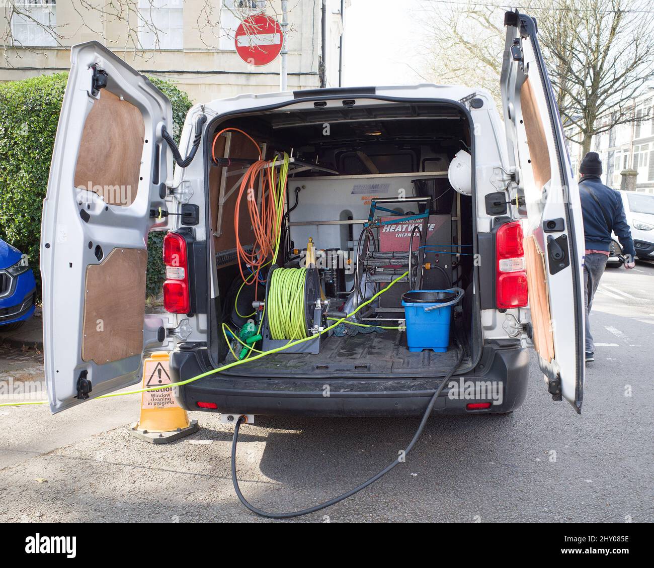 March 2022 Inside of a window cleaners van showing his equipment including water tank & hose