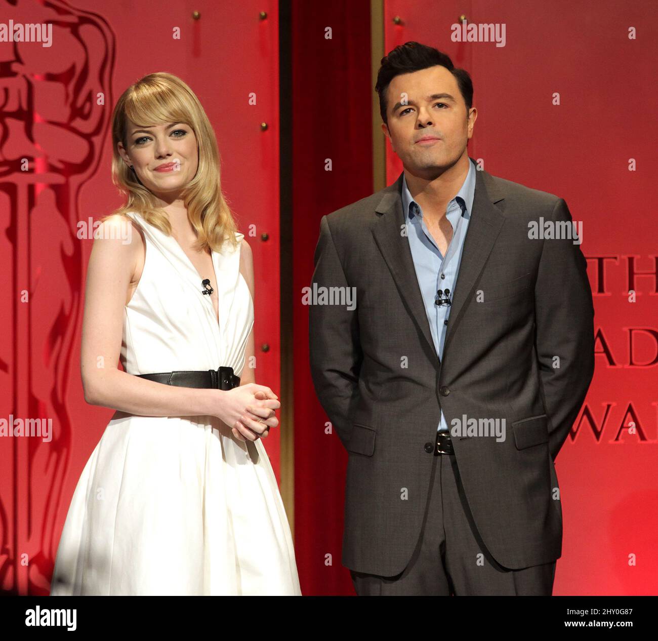 Actress Emma Stone (left) and 2013 Oscars host Seth MacFarlane present