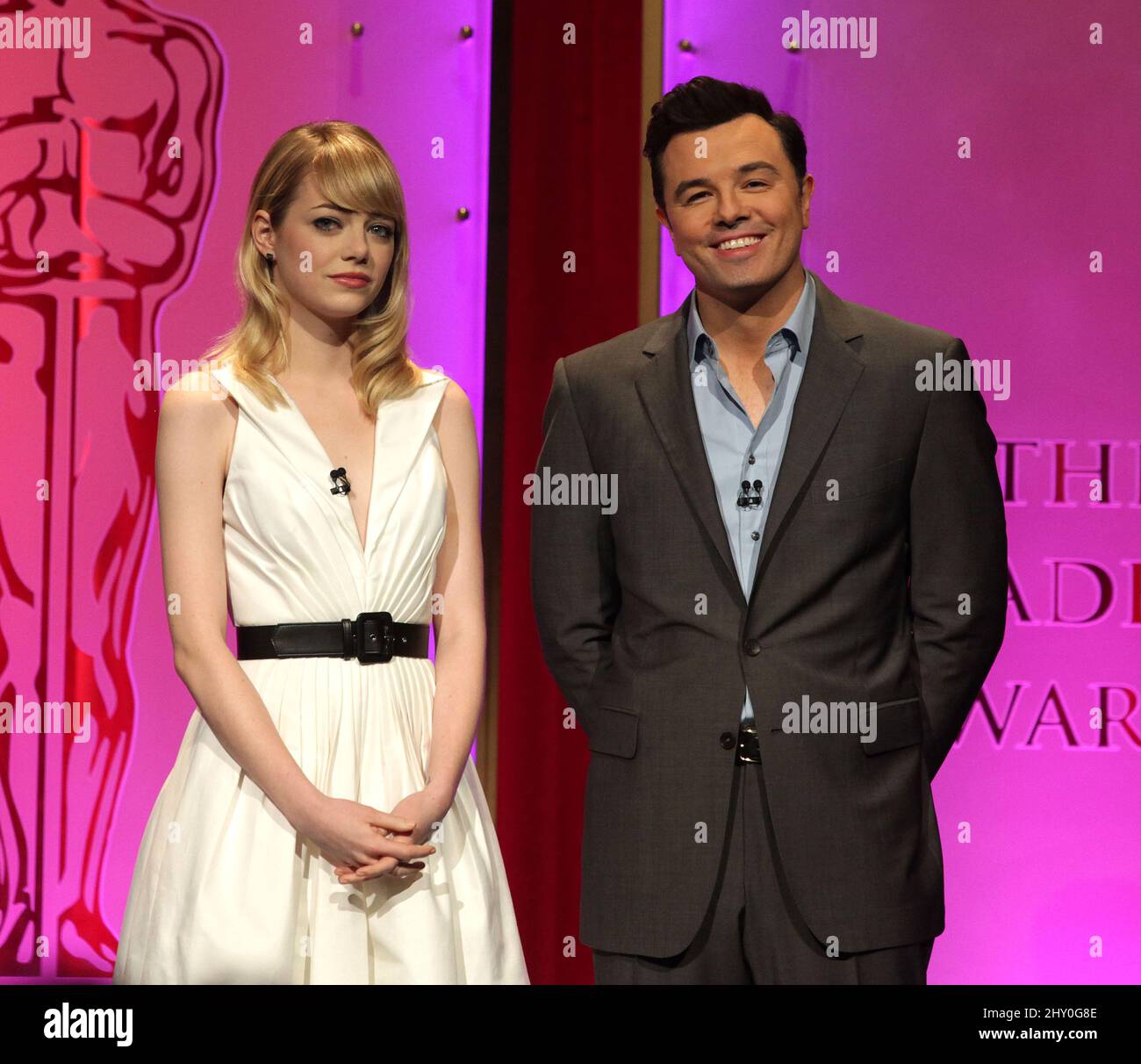 Actress Emma Stone (left) and 2013 Oscars host Seth MacFarlane present