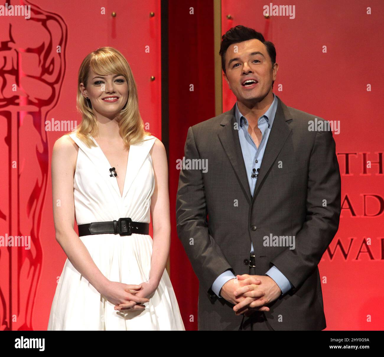 Actress Emma Stone (left) and 2013 Oscars host Seth MacFarlane present