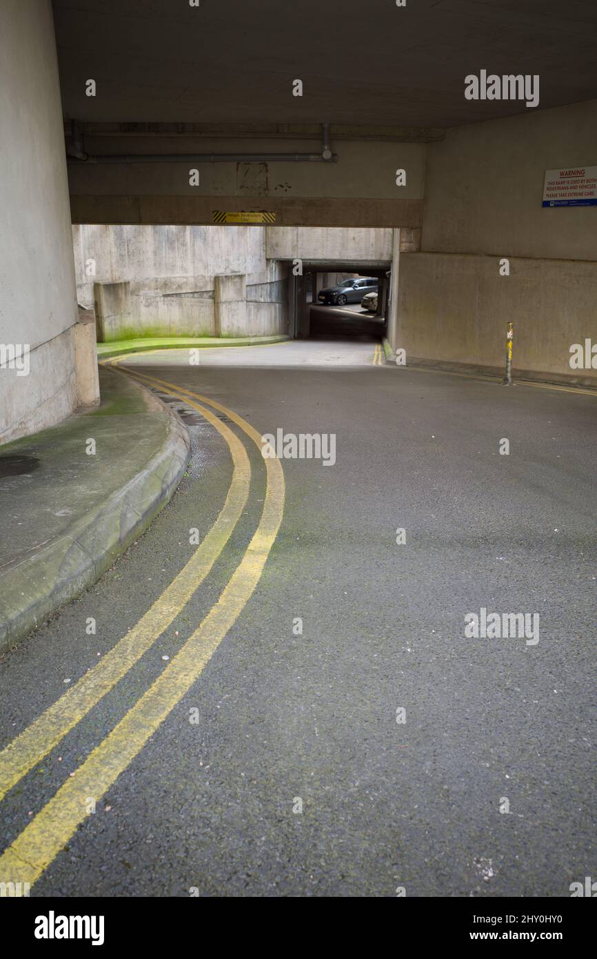 March 2022 - Underground car park entrance ramp, in Bristol, England, UK. Stock Photo