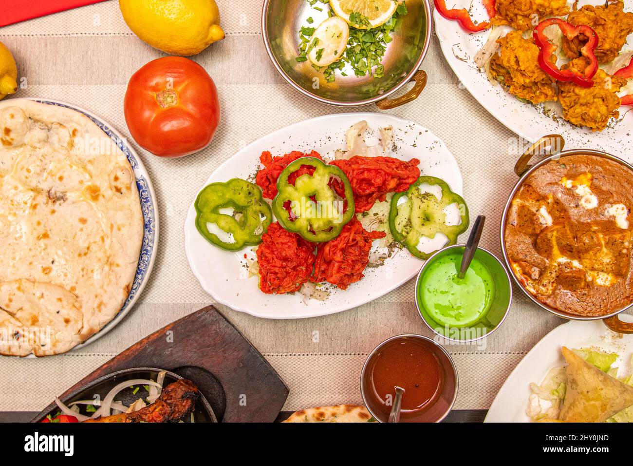 Set of Indian food dishes, peppers, sauces, tomatoes, red curry, onion