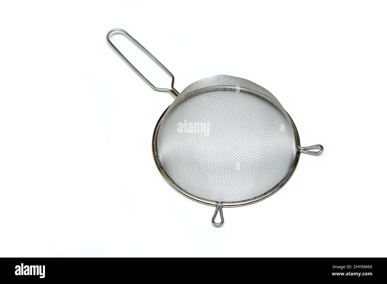 The simple new stainless strainer isolated in a white background. Stock Photo
