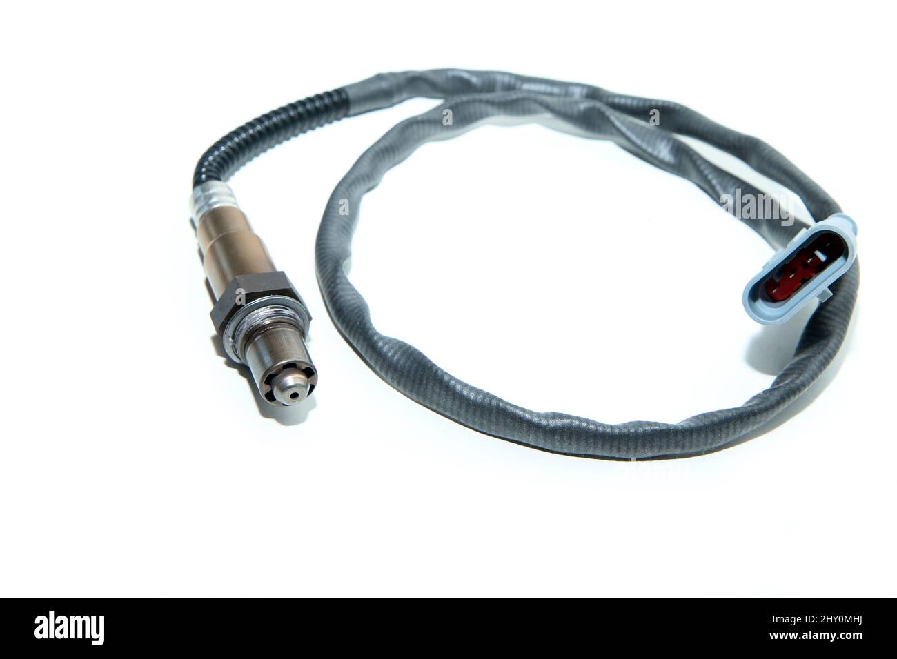The new oxygen sensor (or lambda sensor) for measurement of gas and oxygen ratio isolated in a white background. Stock Photo