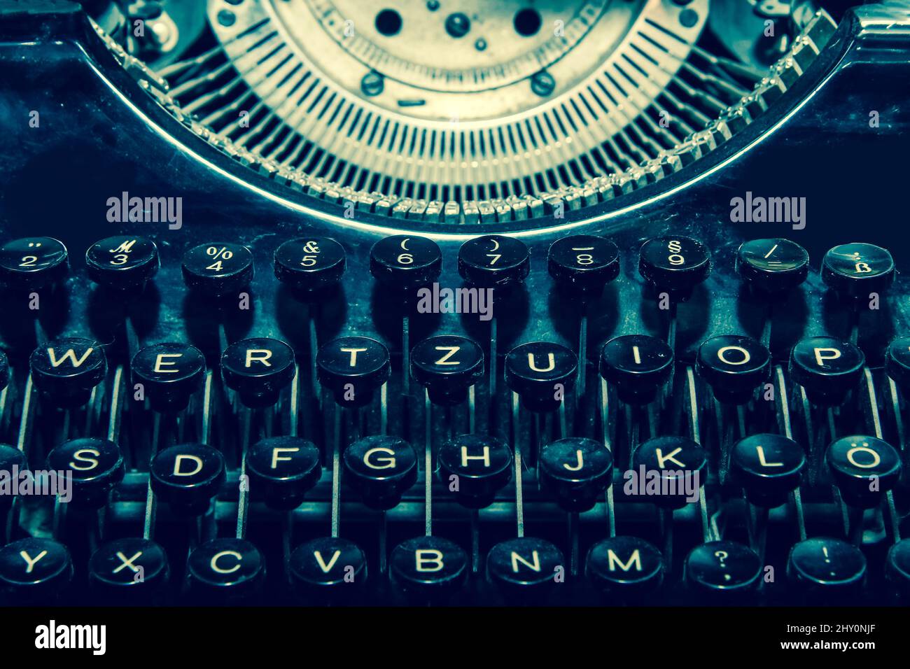 The detail picture of the old retro mechanical typewriter in retro faded colors. Stock Photo