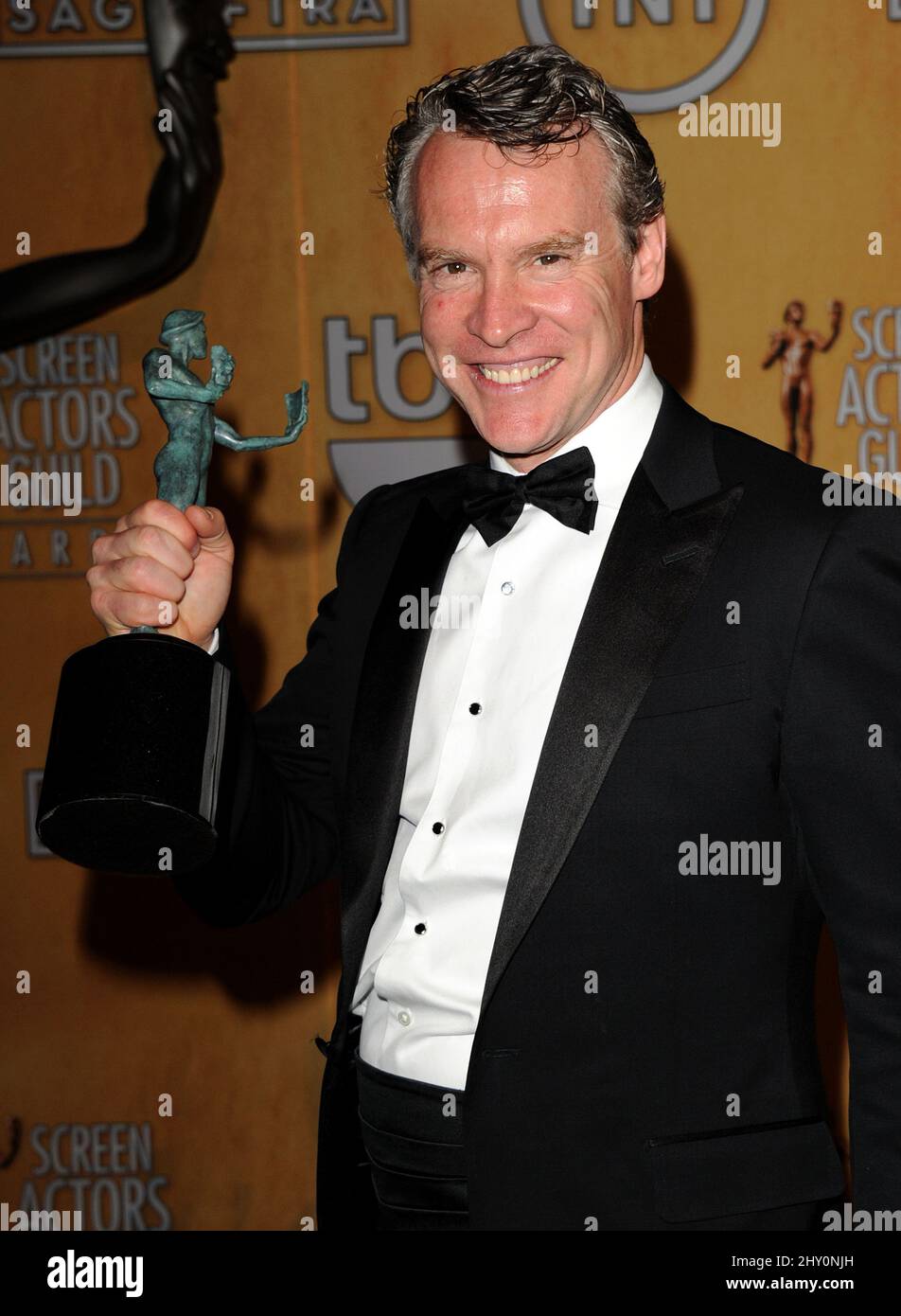 Tate Donovan smiles backstage with the award for outstanding cast in a motion picture for '“Argo'” at the 19th Annual Screen Actors Guild Awards. Stock Photo