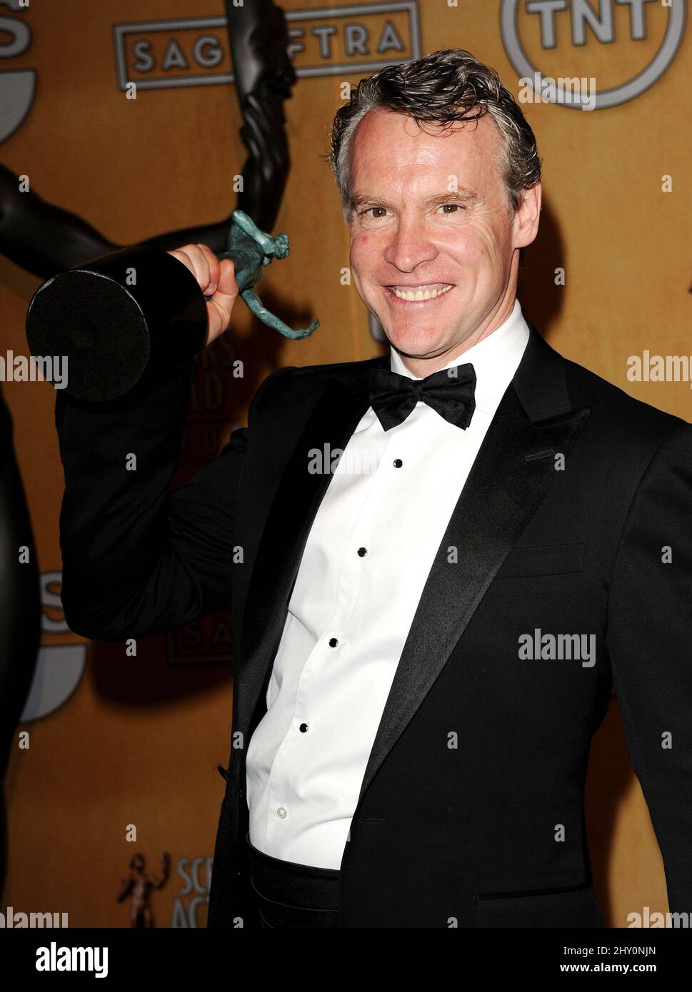 Tate Donovan smiles backstage with the award for outstanding cast in a motion picture for '“Argo'” at the 19th Annual Screen Actors Guild Awards. Stock Photo