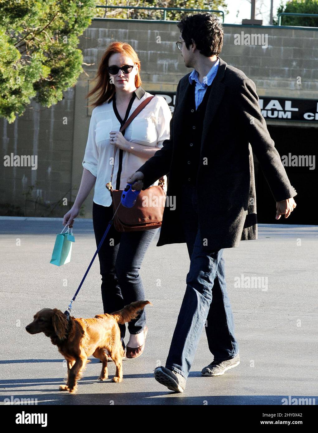 Christina Hendricks and husband Geoffrey Arend are seen walking their