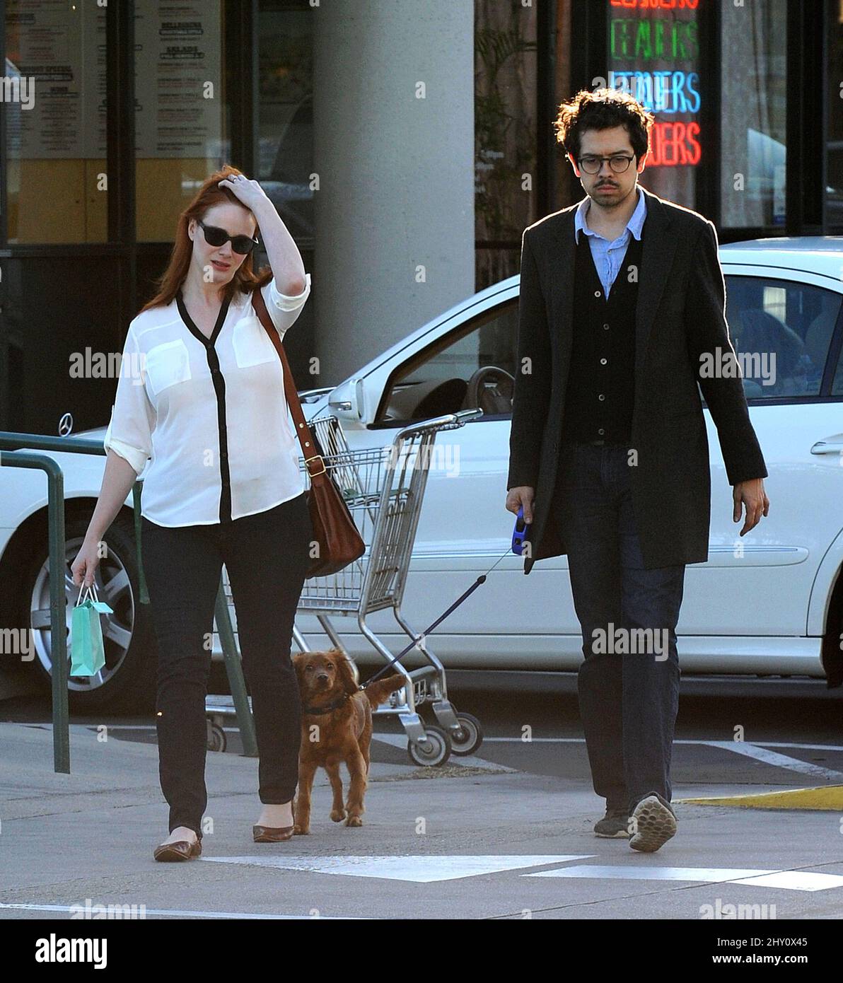 Christina Hendricks and husband Geoffrey Arend are seen walking their dog in Los Angeles, USA. Stock Photo