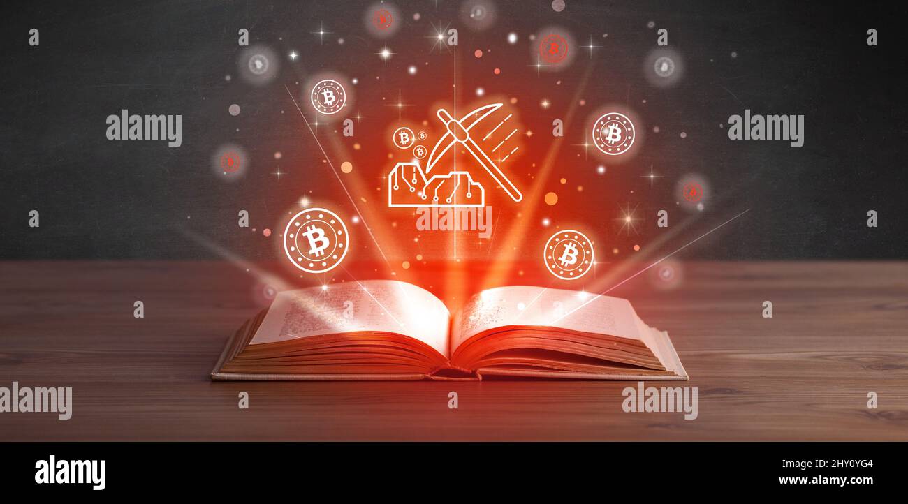 Open book with currency icons above Stock Photo - Alamy