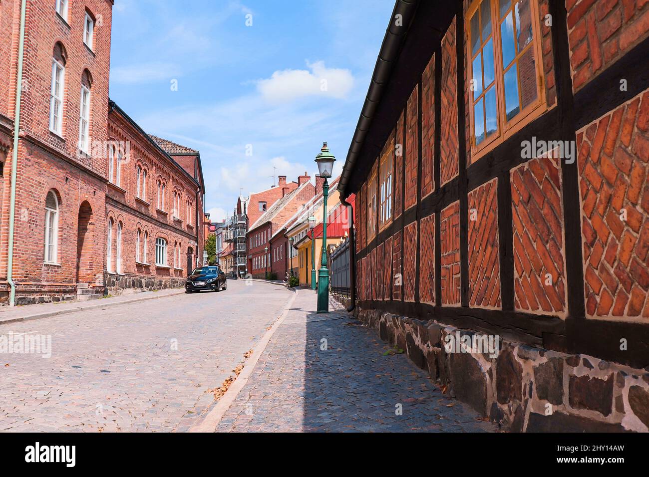 Old red brick house in the city in summer Stock Photo Alamy