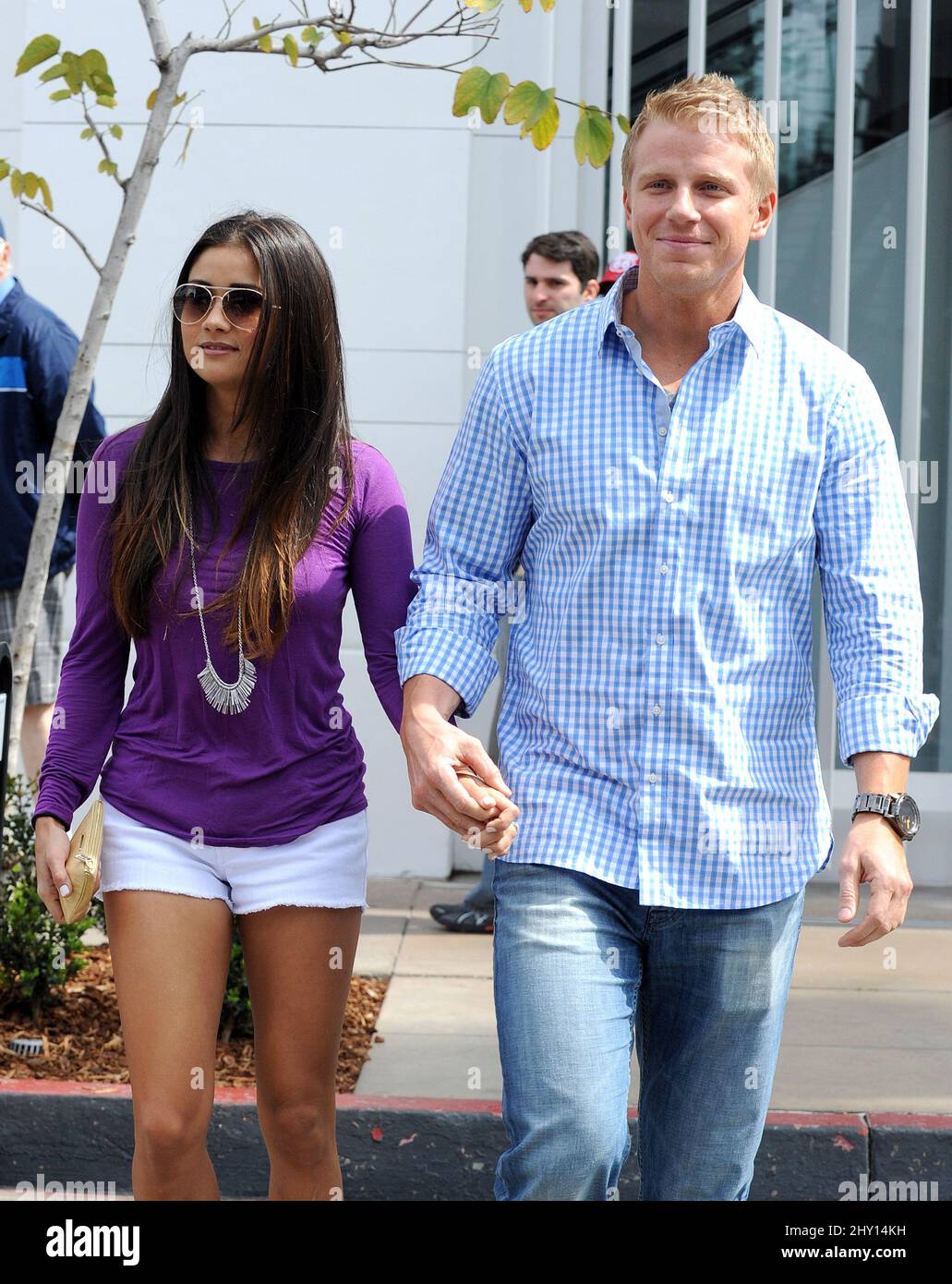Sean Lowe and fiancee Catherine Giudici seen out and about on set of 'Extra' at the Grove in Los Angeles, California. Stock Photo