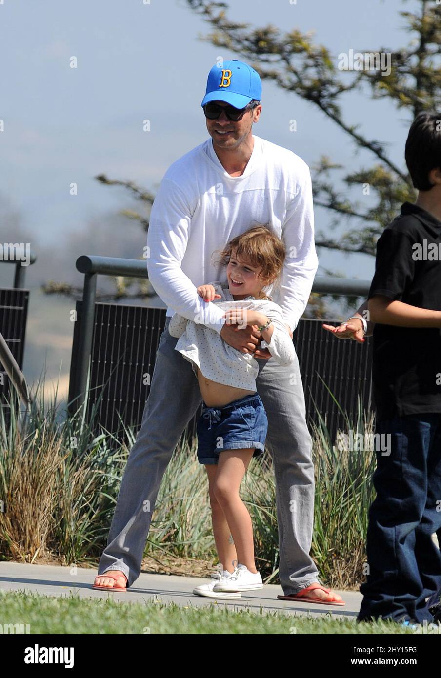 Cash Warren and his daughters Honor attending a birthday party at