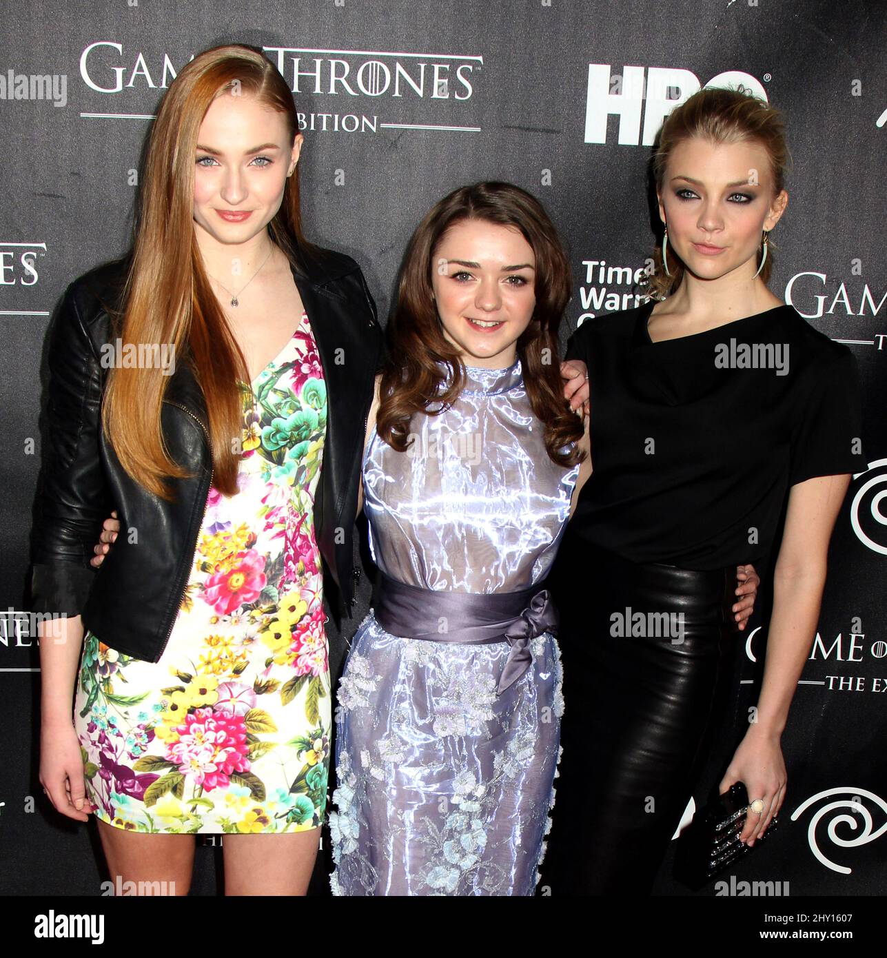 Sophie Turner, Maisie Williams (centre), and Natalie Dormer (right) attends the 'Game Of Thrones' exhibition opening hosted by HBO and Time Warner Cable on Wednesday March 27, 2013 in New York. Stock Photo