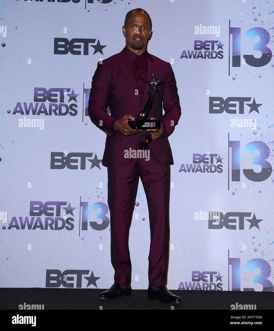 Jamie Foxx poses backstage with the award for best actor for "Django Unchained" at the BET