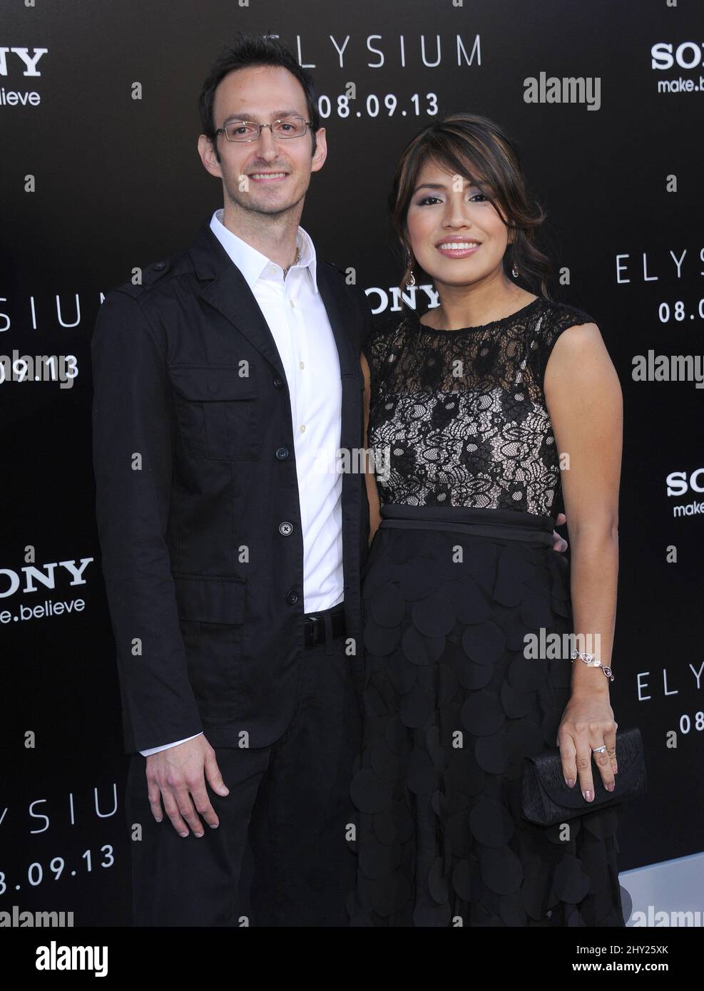 Ryan Amon & Carla Rodriguez attending the Elysium world premiere held at the Regency Village Theatre in Westwood, Los Angeles, CA, USA, August 7, 2013. Stock Photo