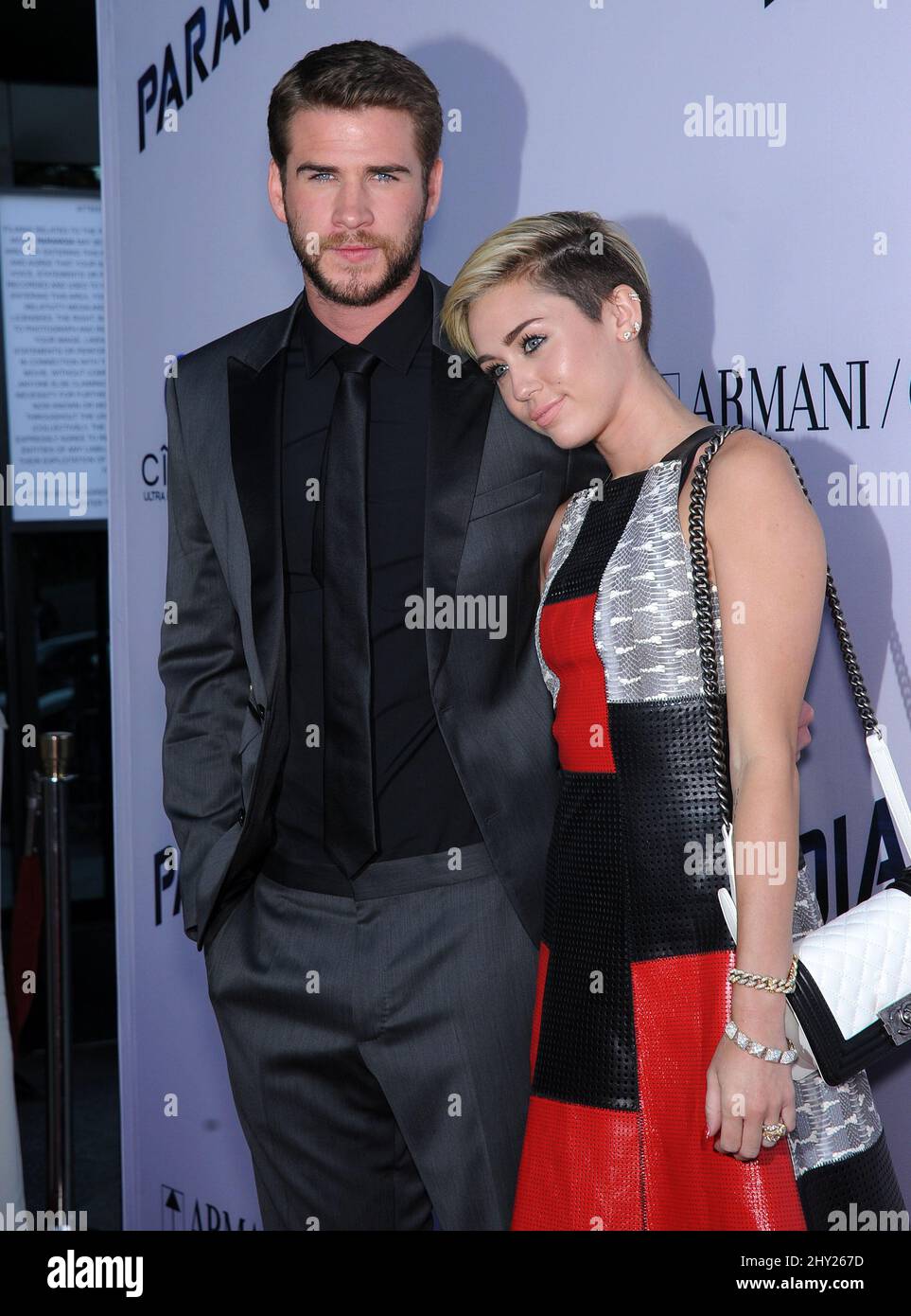 Liam Hemsworth & Miley Cyrus attends the 'Paranoia' US premiere held at the Directors Guild of America, Los Angeles. Stock Photo