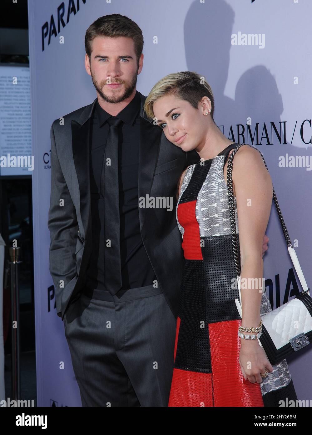 Liam Hemsworth & Miley Cyrus attends the 'Paranoia' US premiere held at the Directors Guild of America, Los Angeles. Stock Photo