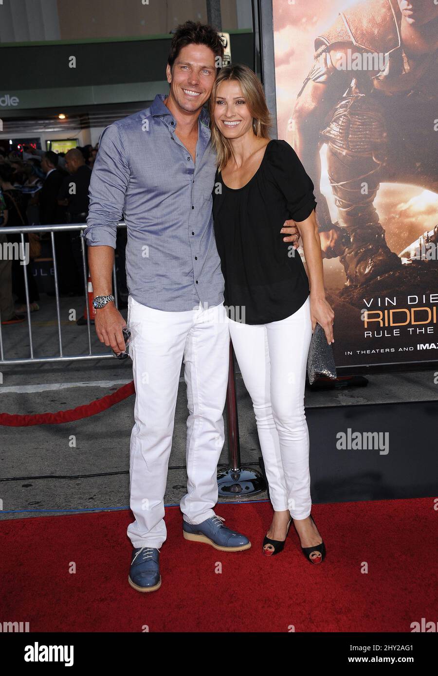 Michael Trucco & Sandra Hess attends as Universal Pictures presents the World Premiere of 'Riddick' at The Westwood Village Theater in Los Angeles Stock Photo