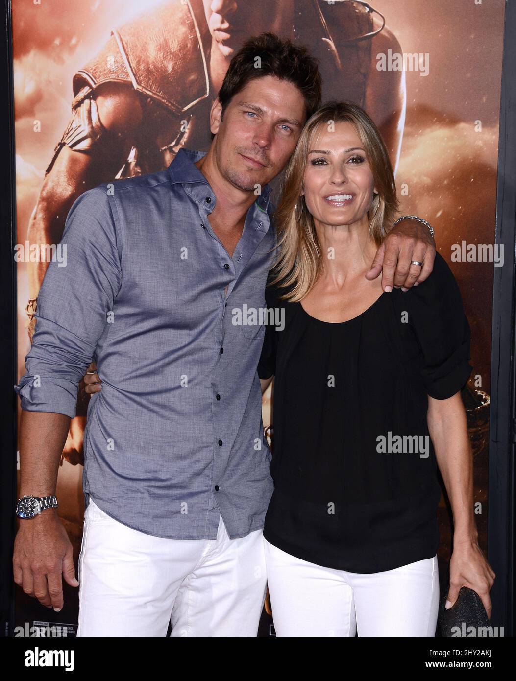 Michael Trucco and Sandra Hess attends as Universal Pictures presents the World Premiere of 'Riddick' at The Westwood Village Theater in Los Angeles. Stock Photo