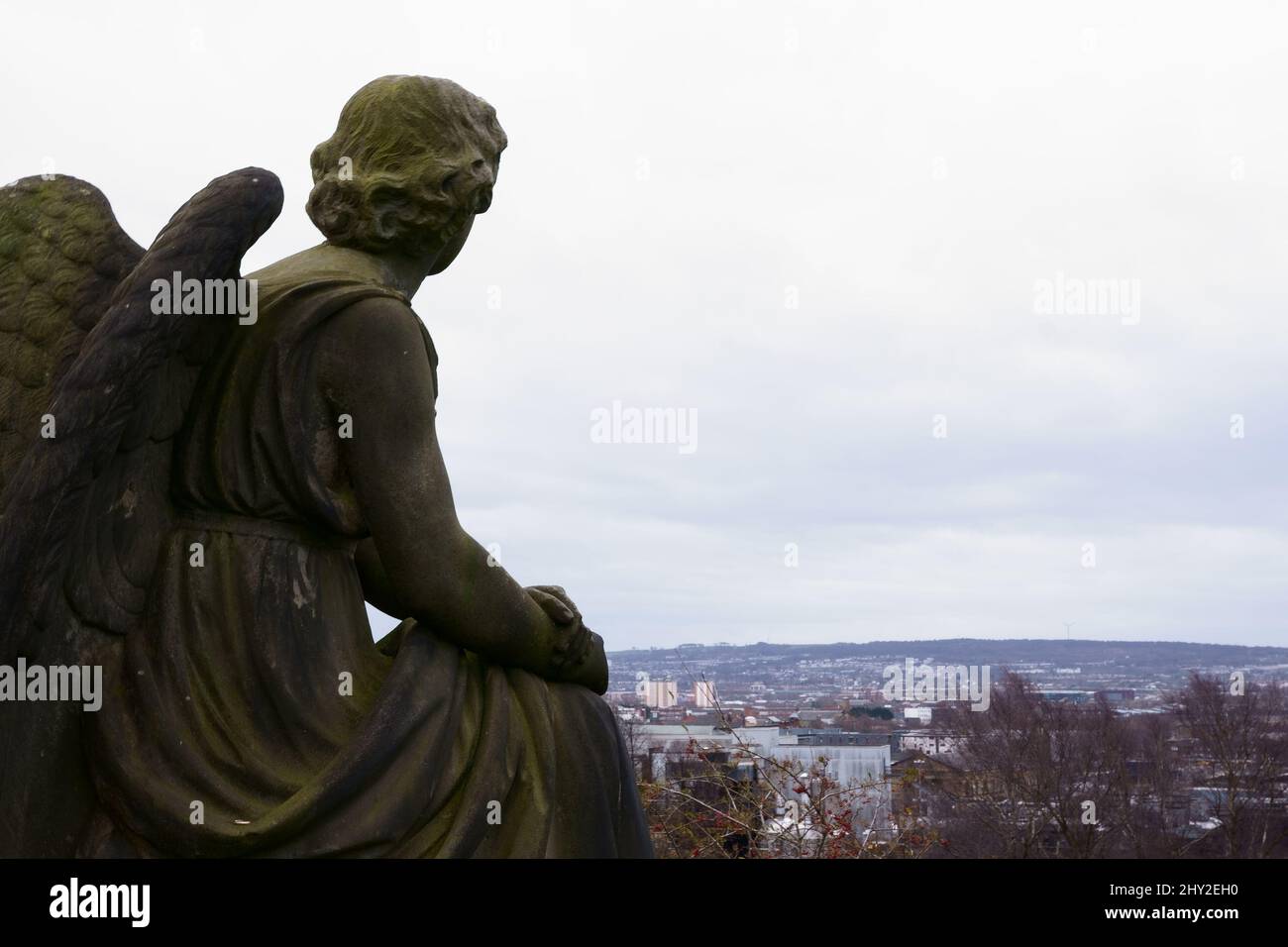 An angel memorial stone sculpture in the Glasgow Necropolis graveyard