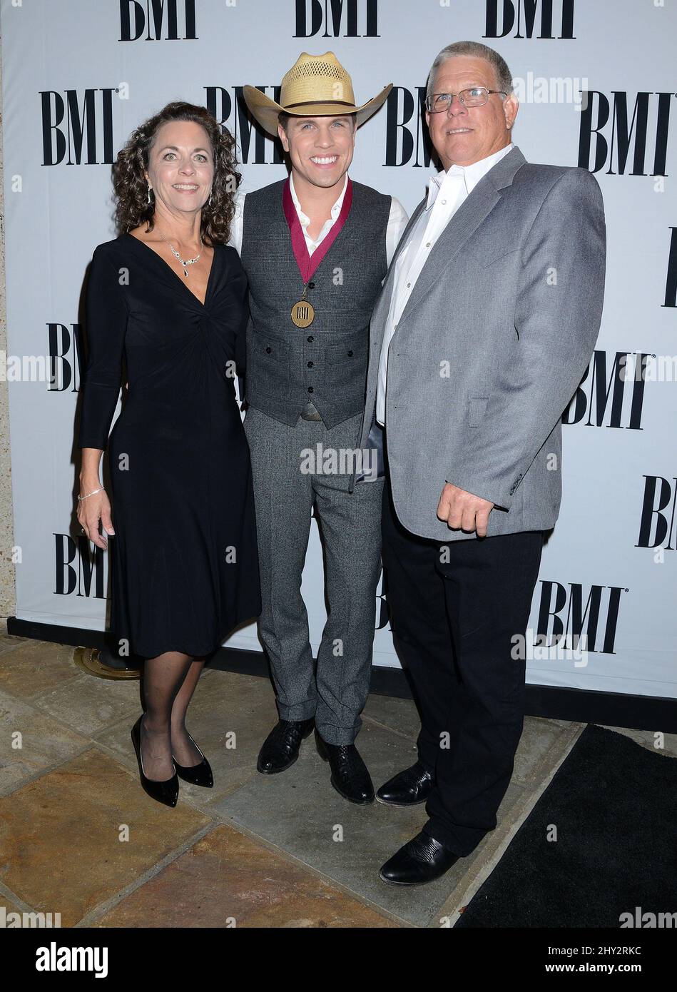 Dustin Lynch with parents Chuck & Patti Lynch attending the 61st annual