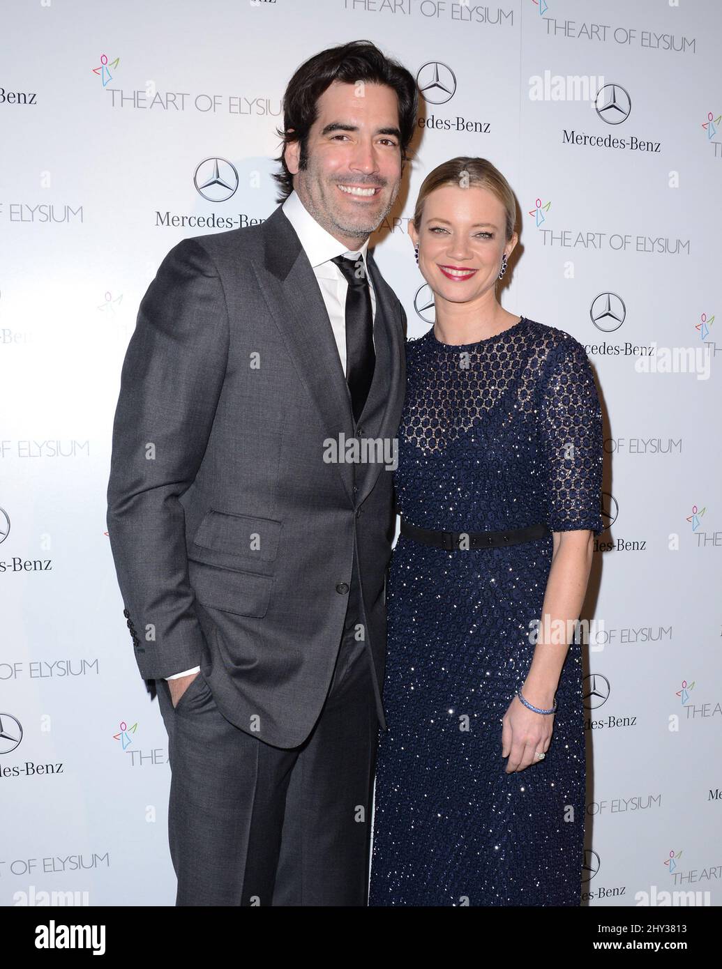 Amy Smart and Carter Oosterhouse attending The Art of Elysium's 7th ...