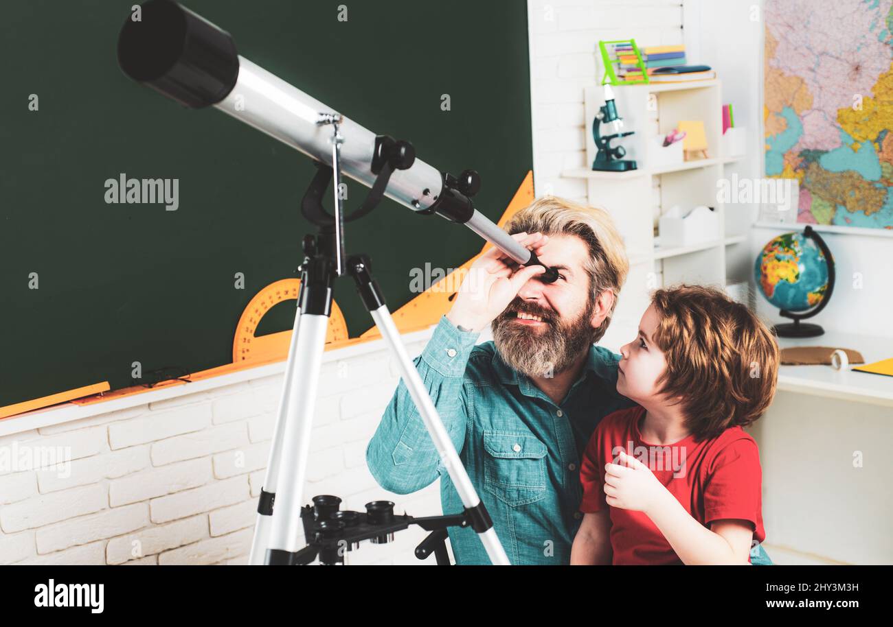 Pupil watching stars with a teacher. Astronomy telescope. Father ...