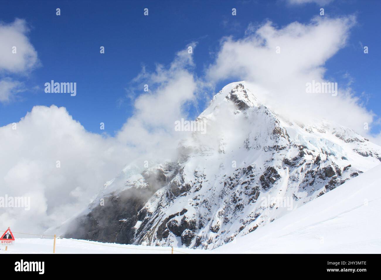 Scenic view of a mountain peak covered with snow on a sunny day Stock ...