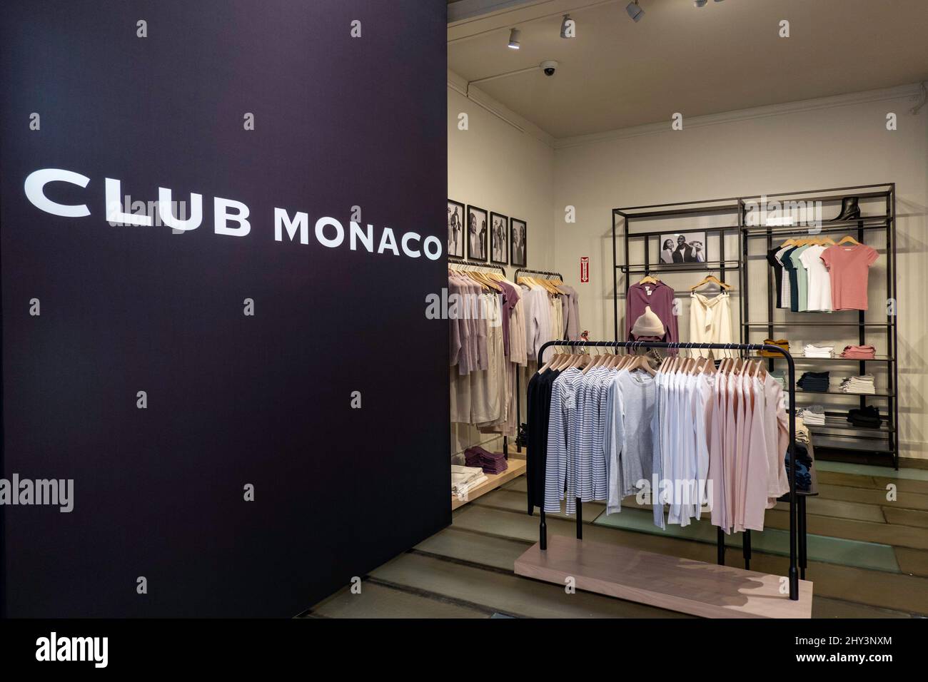 Club Monaco is an affordable luxury fashion store in the landmark Charles Scribner's Sons landmark building on Fifth Avenue, NYC, USA 2022 Stock Photo