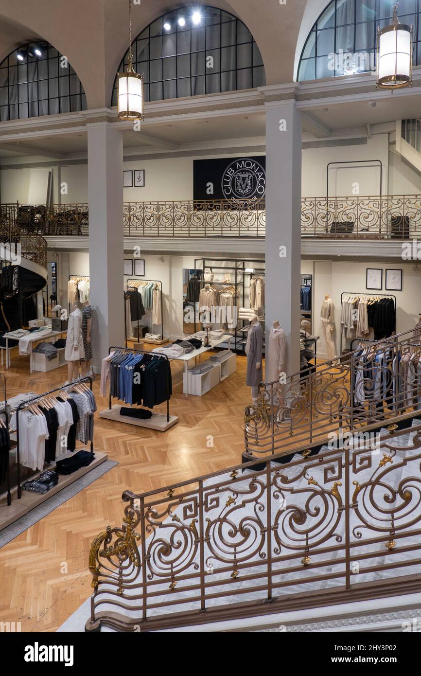 Club Monaco is an affordable luxury fashion store in the landmark Charles Scribner's Sons landmark building on Fifth Avenue, NYC, USA 2022 Stock Photo