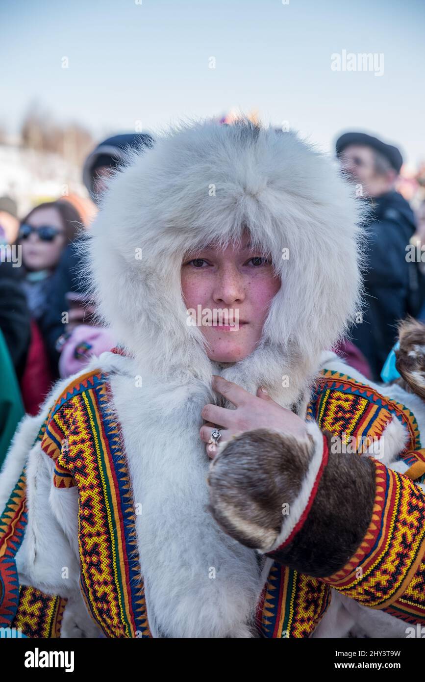 Young Nenet woman in traditional reindeer fur clothes at Reindeer ...