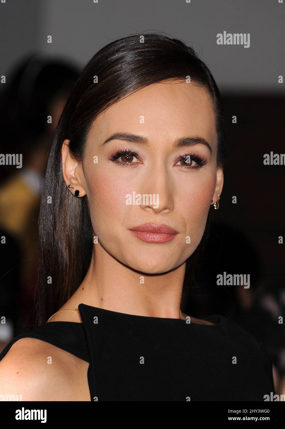 Maggie Q arriving for the Divergent Premiere held at the Regent Bruin Theatre, Los Angeles. Stock Photo
