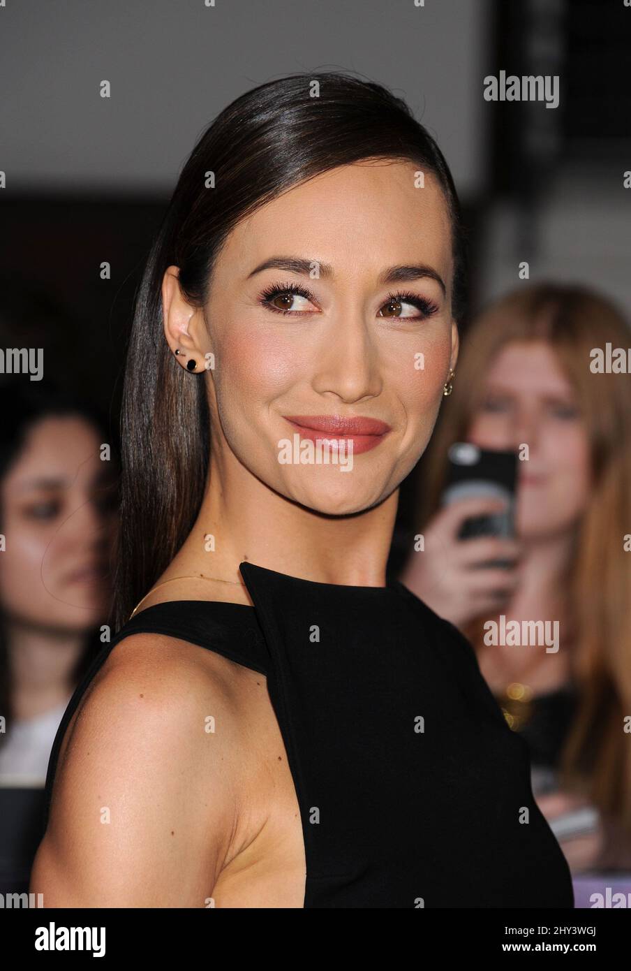 Maggie Q arriving for the Divergent Premiere held at the Regent Bruin Theatre, Los Angeles. Stock Photo