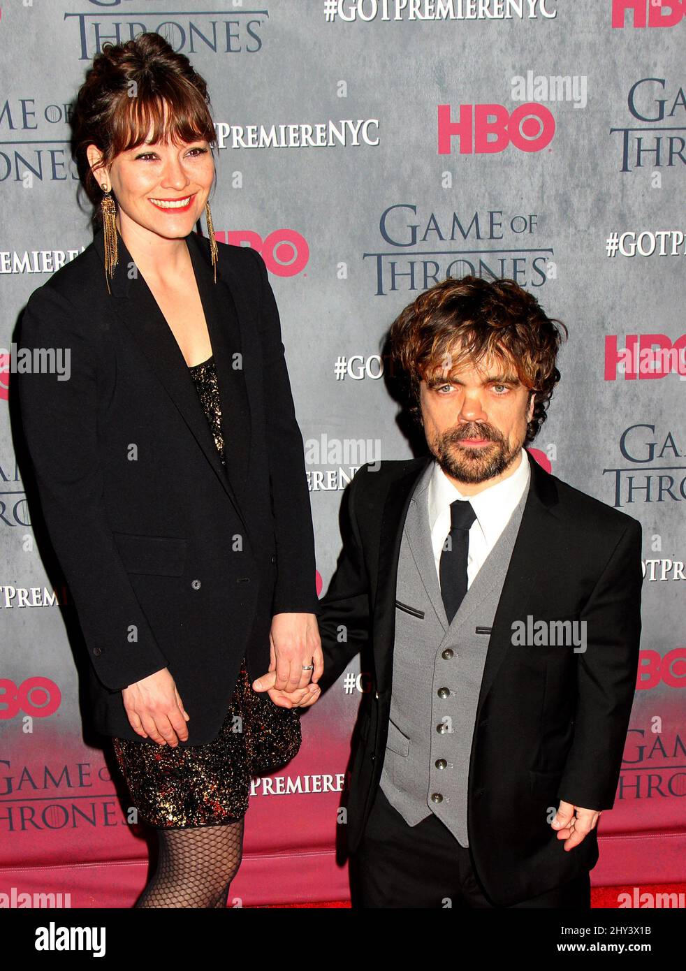 Erica Schmidt and Peter Dinklage attending the season four premiere of Game of Thrones in New York. Stock Photo