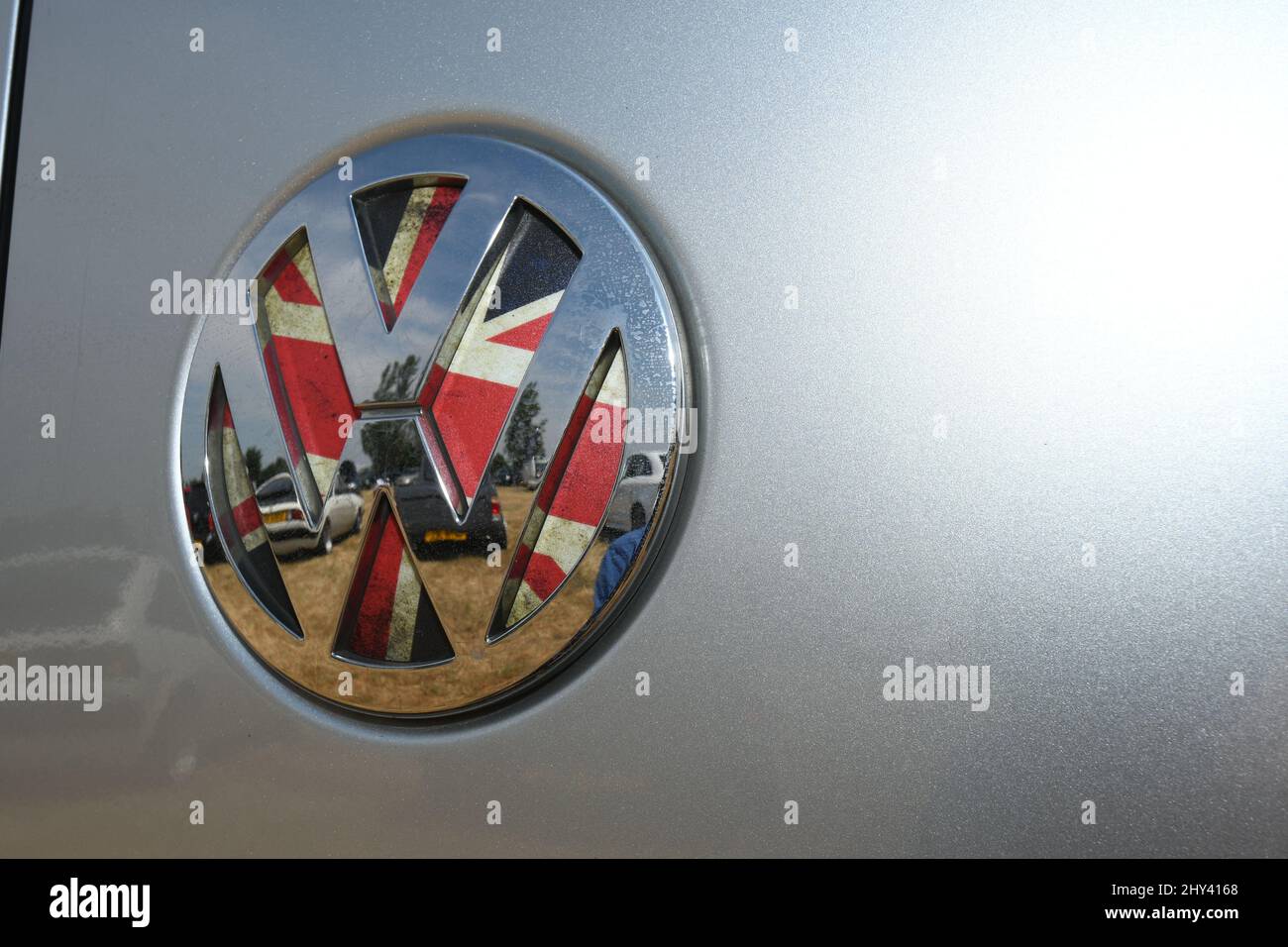 Closeup shot of a VW badge logo on Union Jack background Stock Photo