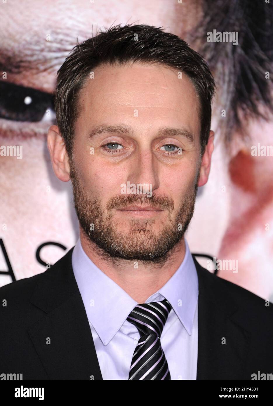 Josh Stewart arrives at the LA Premiere Of 'Transcendence' on Thursday, April 10, 2014, in Los Angeles. Stock Photo