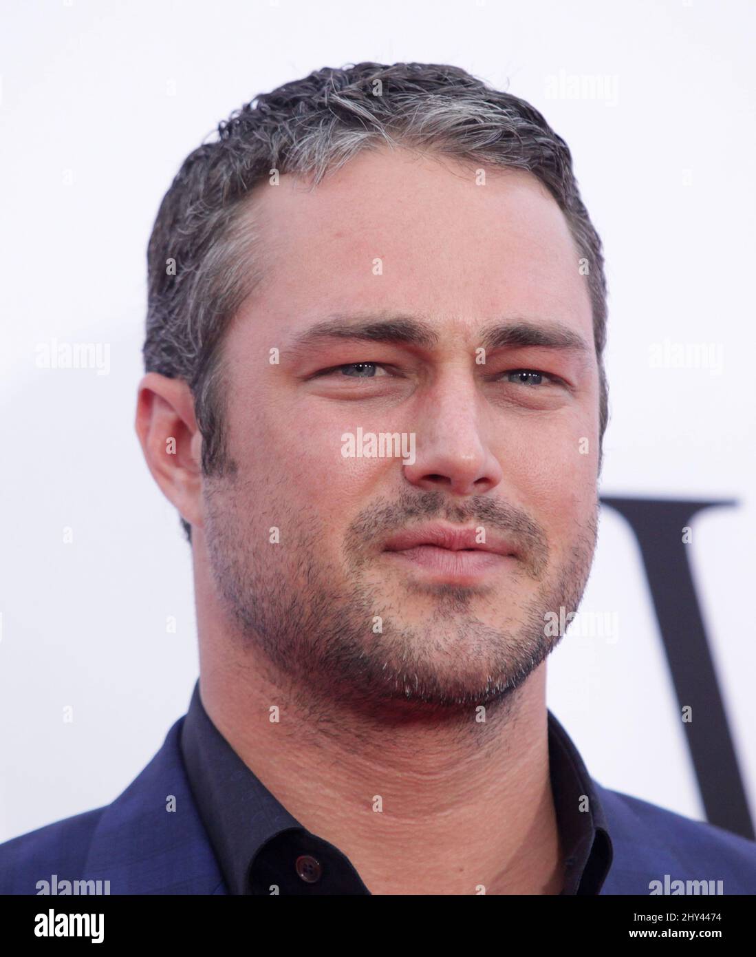 Taylor Kinney arriving for the premiere of The Other Woman held at the Regency Village Theater in Los Angeles. Stock Photo
