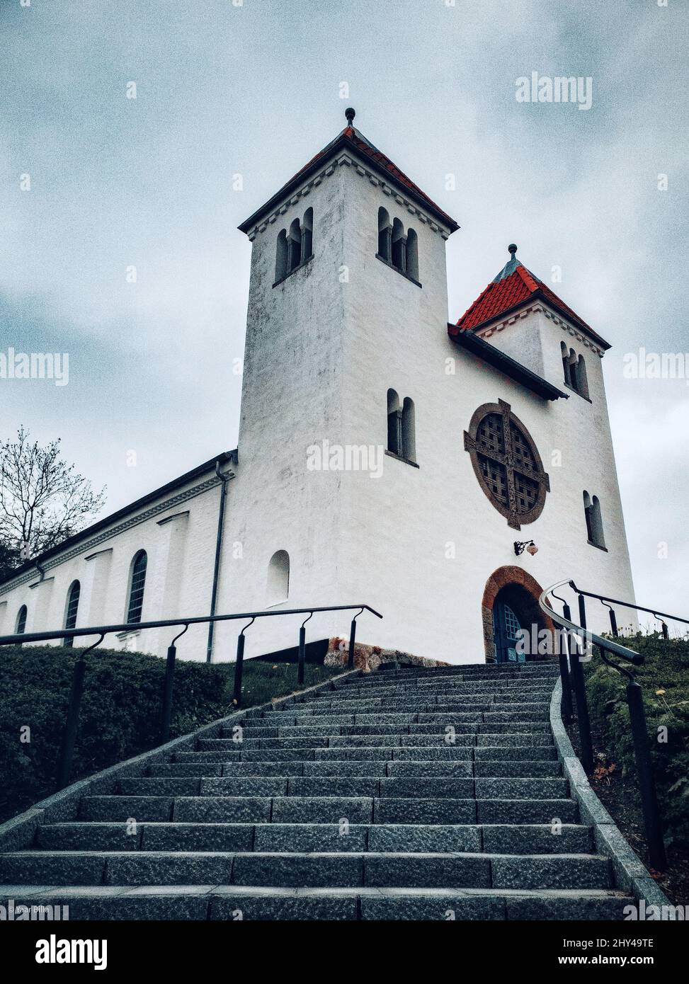 Vertical shot of an old church building on cloudy sky background Stock ...