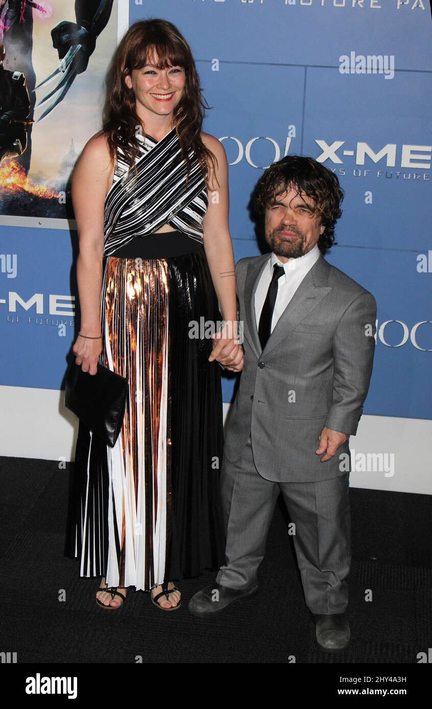 Peter Dinklage and Erica Schmidt attending the 'X-Men: Days Of Future Past' World Premiere at the Jacob Javits Center on May 10, 2014. Stock Photo