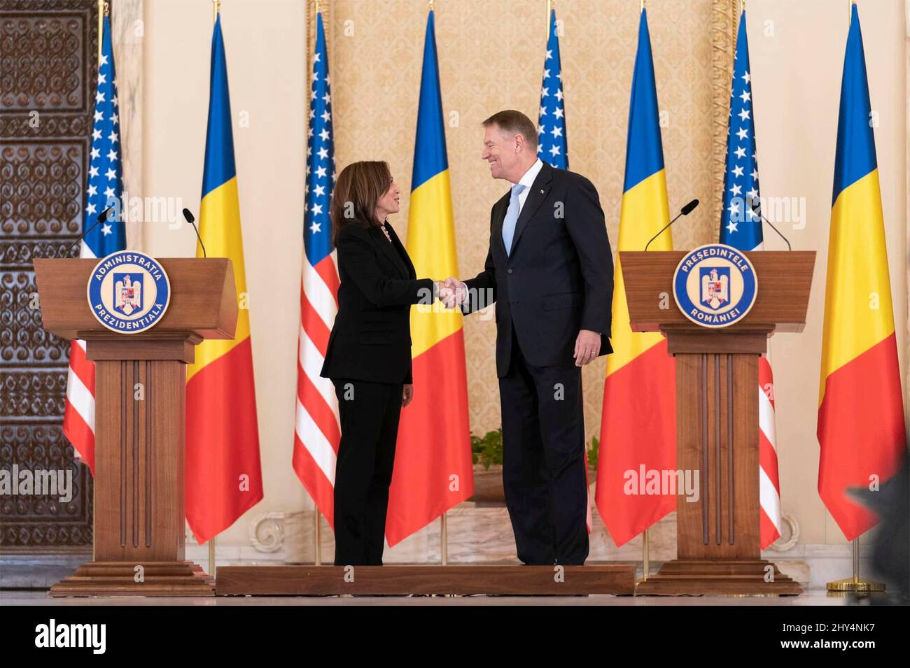 Bucharest, Romania. 11 March, 2022. U.S Vice President Kamala Harris shakes hands with Romanian President Klaus Iohannis, right, following a joint press conference at the Cotroceni Palace, March 11, 2022 in Otopeni, Romania. Harris visited Romania to discuss the crisis in Ukraine with NATO allies.  Credit: Lawrence Jackson/White House Photo/Alamy Live News Stock Photo