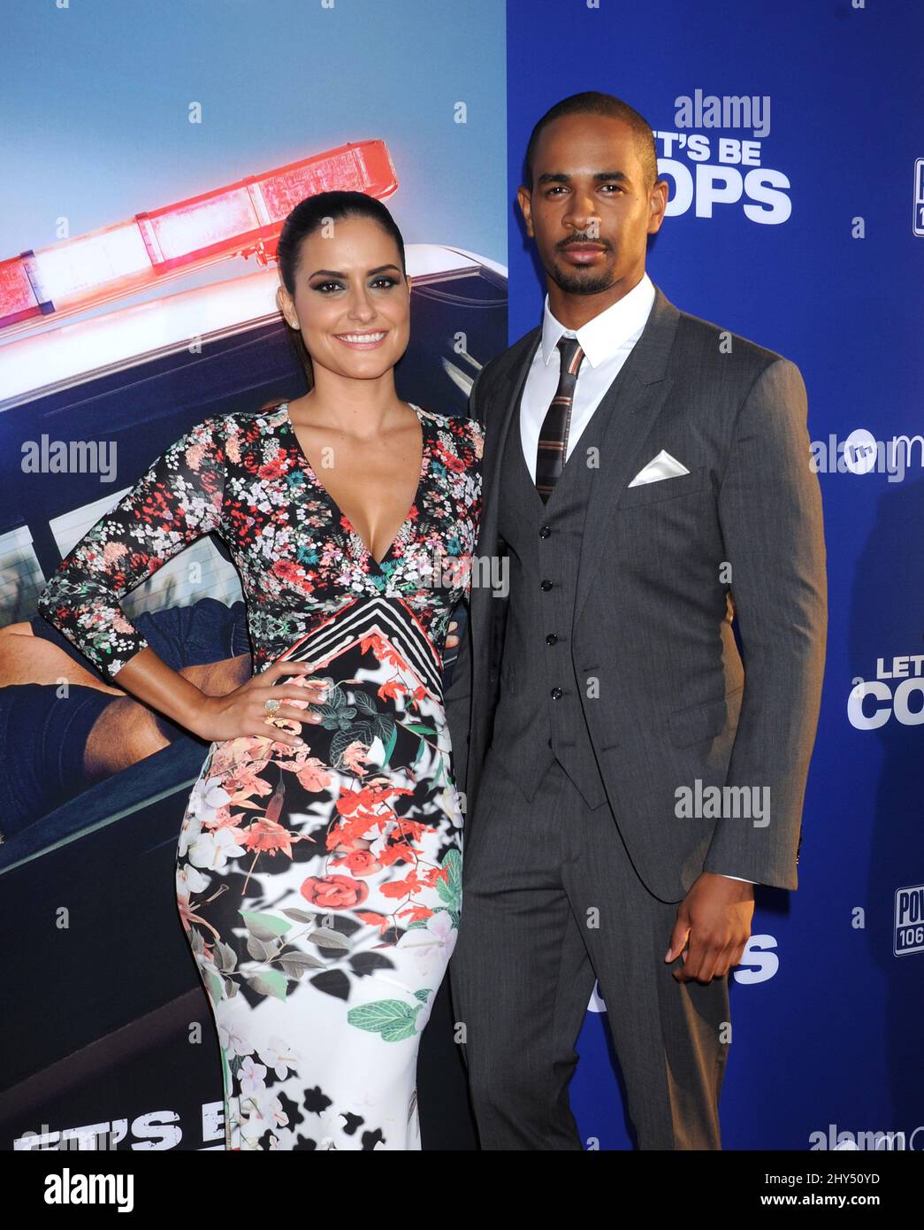 Damon Wayans Jr. and Sameera attending the 'Let's Be Cops' premiere held at the Cinerama Dome in Los Angeles, USA. Stock Photo
