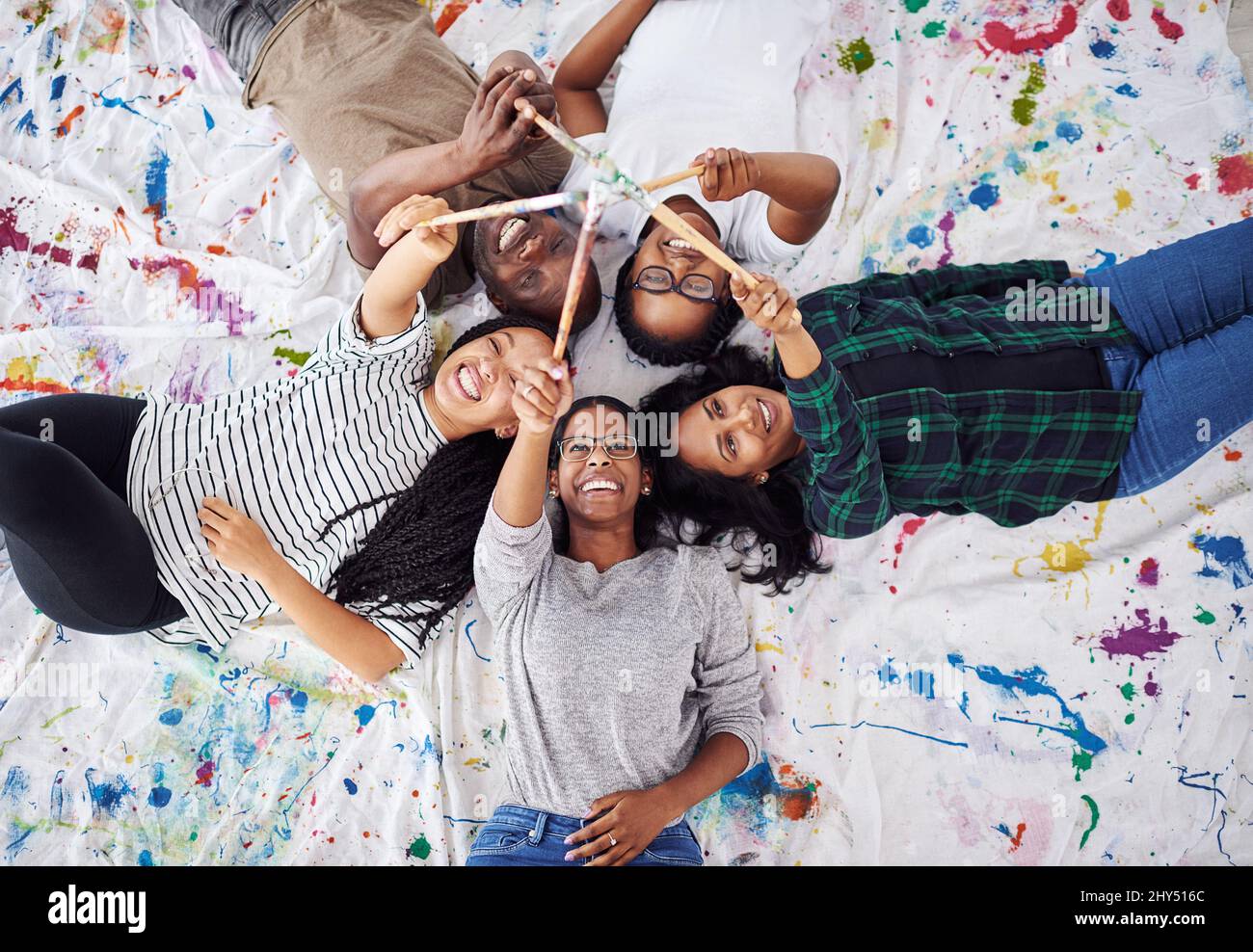 Art makes you look at the world differently. Shot of a group of artists