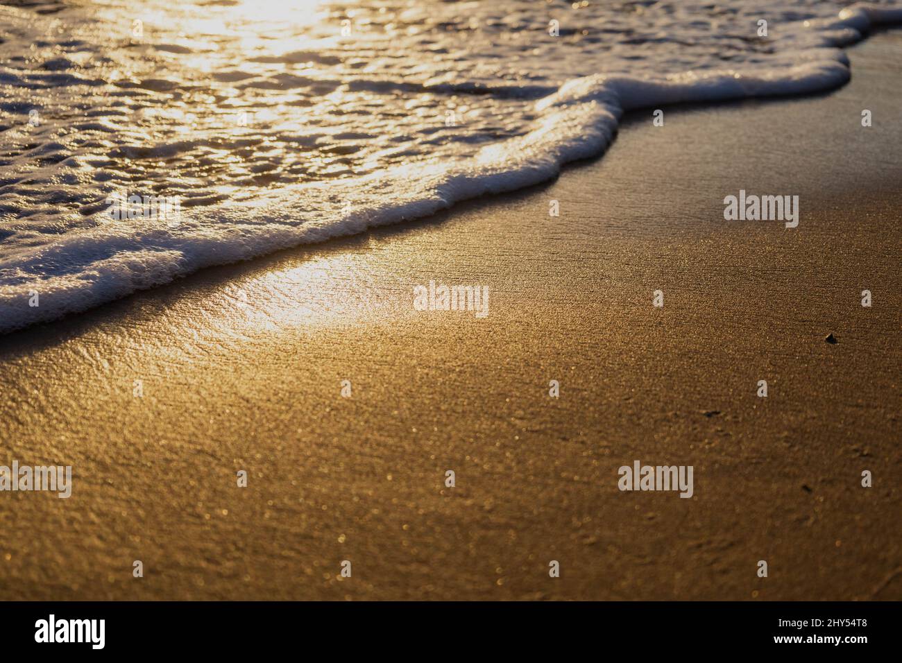 Ocean waves washing sandy beach hi-res stock photography and images - Alamy